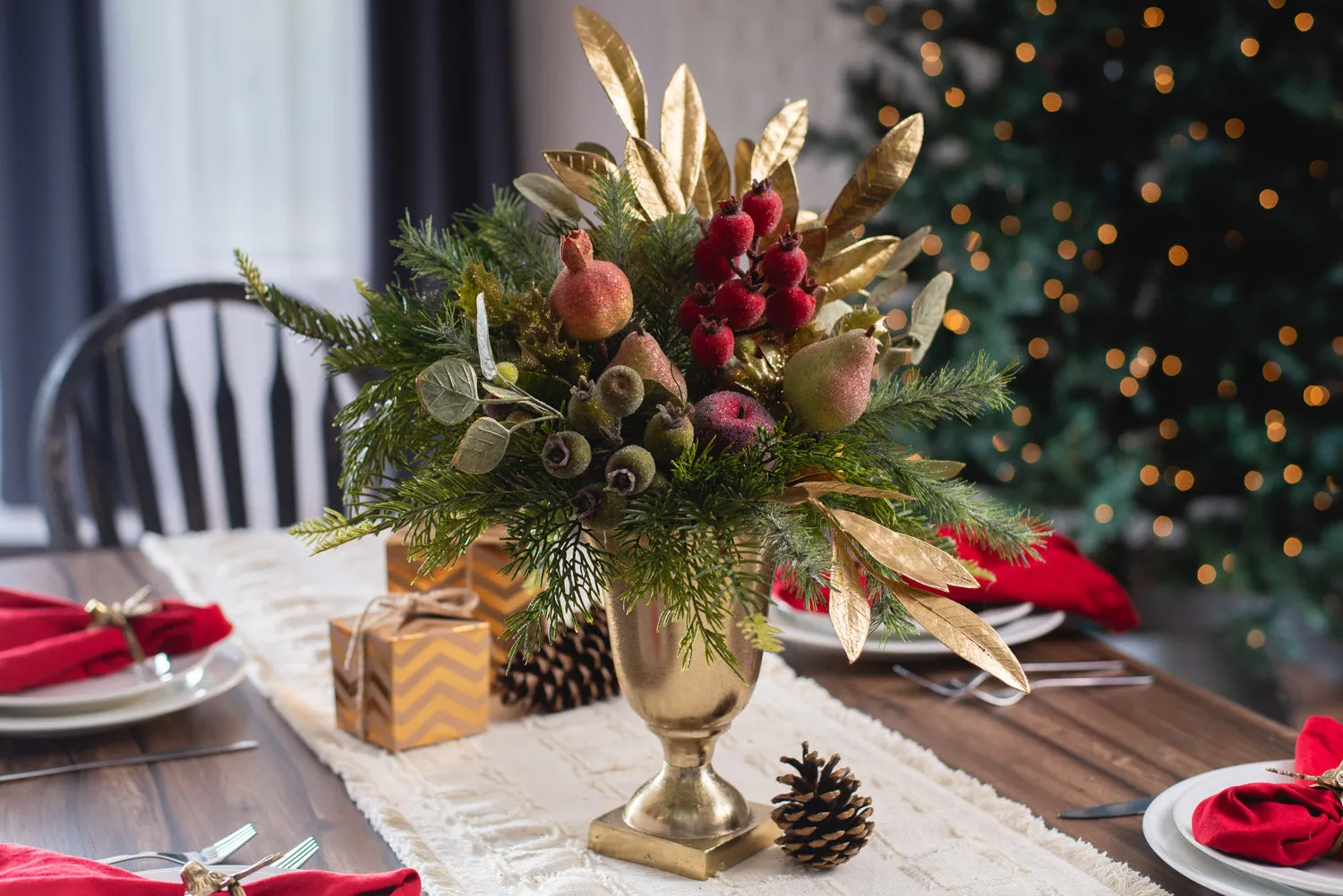 Della Robbia Style Christmas Holiday Arrangement with Sugar Fruit, Beaded Rosehip, Cedar & Gold Bay Leaf Centerpiece in Gold Metal Urn